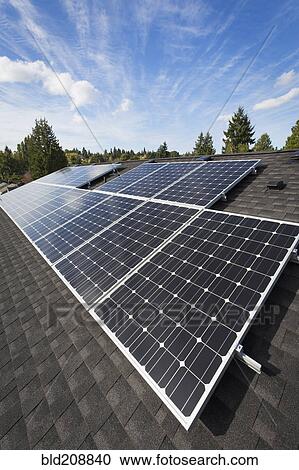 Solar panels fixed on the rooftop of a house View Large Photo Image Stock Image - Solar panels fixed on the rooftop of a house. Fotosearch