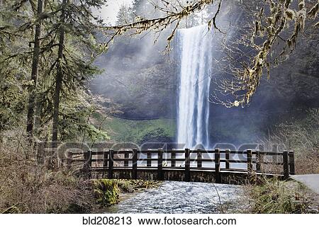 Stock Image - South Falls, cloaked by mist and splashing water. Fotosearch
