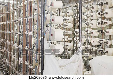 Stock Photography - Spools in textile factory. Fotosearch
