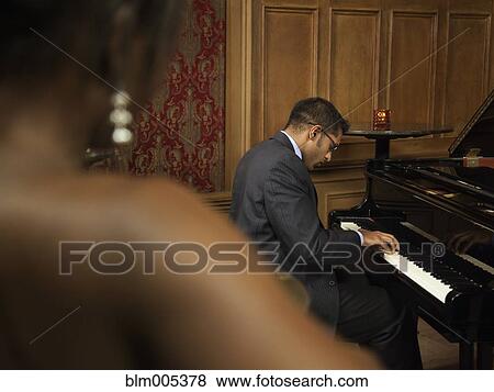 Stock Photo - Sri Lankan pianist performing in nightclub. Fotosearch