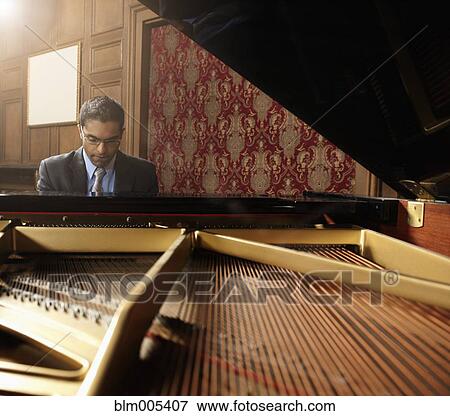 Sri Lankan pianist performing in nightclub View Large Photo Image Stock Photo - Sri Lankan pianist performing in nightclub. Fotosearch
