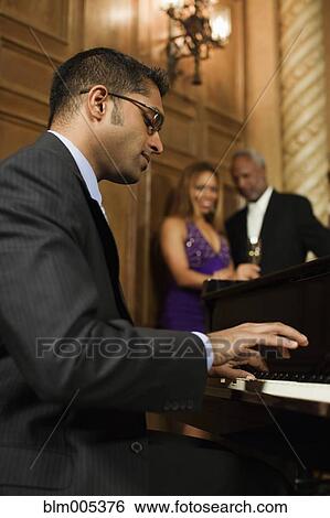 Sri Lankan pianist performing in nightclub View Large Photo Image Stock Photograph - Sri Lankan pianist performing in nightclub. Fotosearch