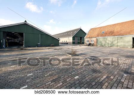Stock Image - Stables and barn at a dairy farm. Fotosearch