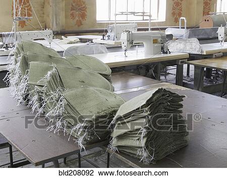 Stock Image - Stacked sacks in textile factory. Fotosearch
