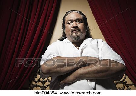 Picture - Stern man with arms crossed. Fotosearch
