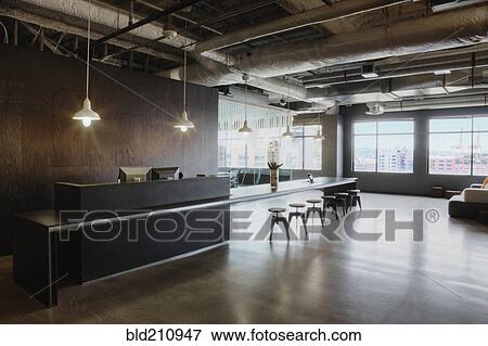 Stock Photo - Stools at bar by reception desk in office. Fotosearch