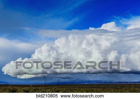Storm clouds moving across rural prairie, Orovada, Nevada, United States View Large Photo Image Stock Photography - Storm clouds moving across rural prairie, Orovada, Nevada, United States. Fotosearch
