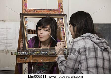 Student painting classmate's face in art class View Large Photo Image Stock Image - Student painting classmate's face in art class. Fotosearch
