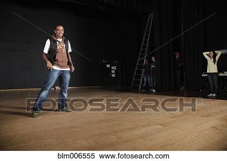 Stock Photography - Student performing on high school stage. Fotosearch