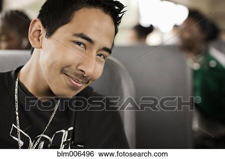 Stock Photograph - Student riding school bus. Fotosearch