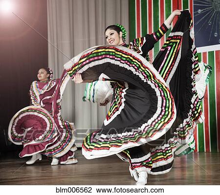 Students performing Mexican folk dance on stage View Large Photo Image Stock Image - Students performing Mexican folk dance on stage. Fotosearch