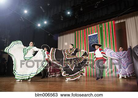Students performing Mexican folk dance on stage View Large Photo Image Stock Image - Students performing Mexican folk dance on stage. Fotosearch