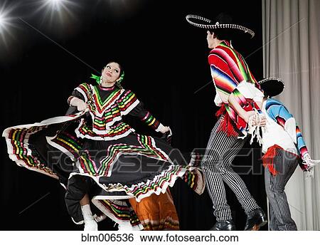 Students performing Mexican folk dance on stage View Large Photo Image Stock Photograph - Students performing Mexican folk dance on stage. Fotosearch