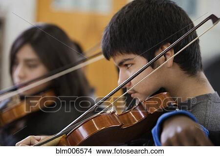 Students practicing in high school orchestra View Large Photo Image Picture - Students practicing in high school orchestra. Fotosearch