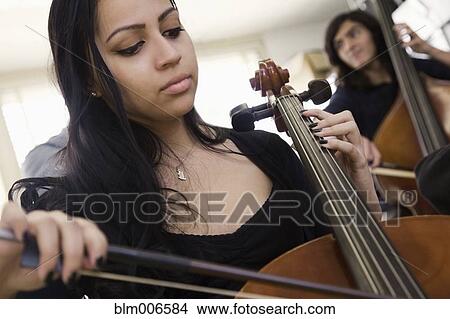 Picture - Students practicing in high school orchestra. Fotosearch