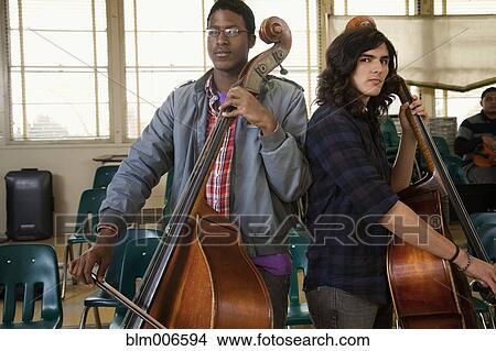 Picture - Students practicing in high school orchestra. Fotosearch
