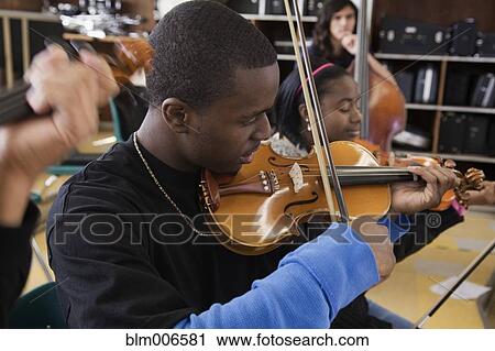 Students practicing in high school orchestra View Large Photo Image Stock Image - Students practicing in high school orchestra. Fotosearch