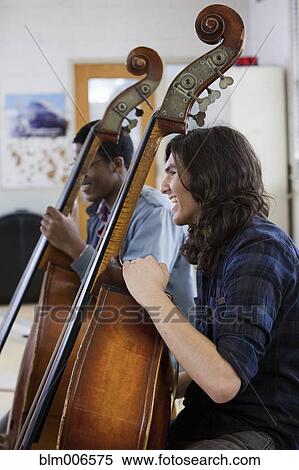 Stock Photography - Students practicing in high school orchestra. Fotosearch