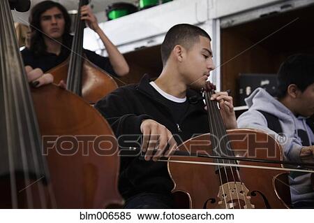 Stock Photography - Students practicing in high school orchestra. Fotosearch