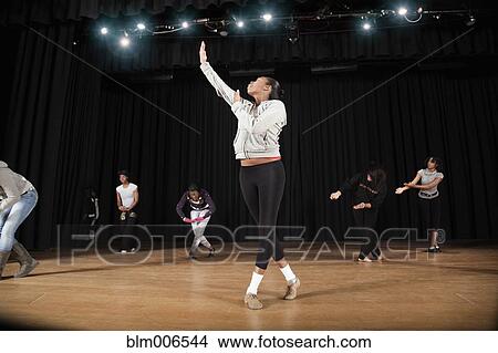Students rehearsing dance on high school stage View Large Photo Image Picture - Students rehearsing dance on high school stage. Fotosearch