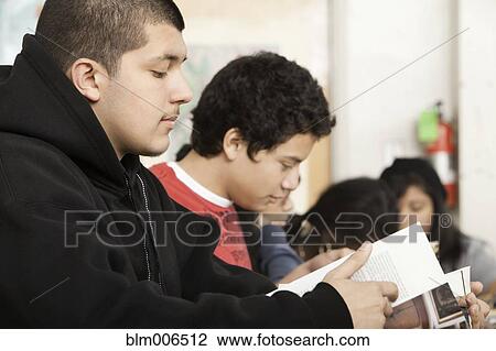 Stock Image - Students studying in classroom. Fotosearch