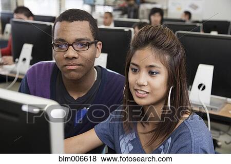 Stock Photo - Students working together in computer lab. Fotosearch