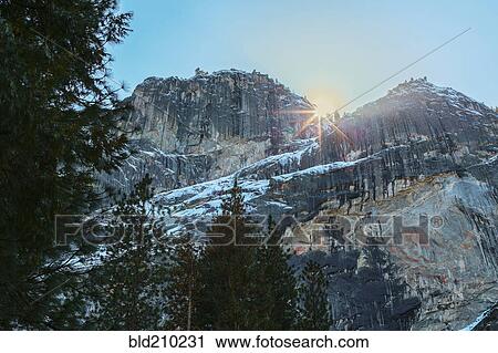 Sun rising over rocky landscape, Yosemite, California, United States View Large Photo Image Stock Image - Sun rising over rocky landscape, Yosemite, California, United States. Fotosearch