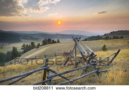 Stock Image - Sunset over the mountains and valleys of Montana. Fotosearch
