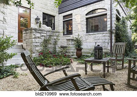 Table and chairs in backyard View Large Photo Image Stock Photo - Table and chairs in backyard. Fotosearch