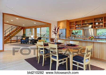Stock Image - Table and chairs in dining room. Fotosearch