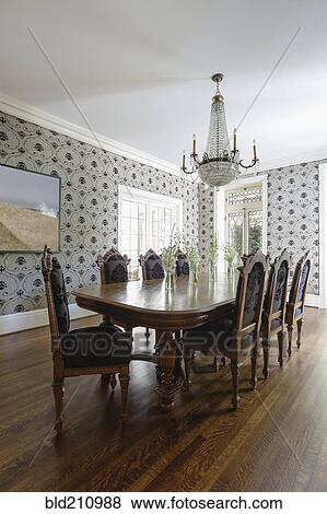 Stock Photo - Table and chairs in ornate dining room. Fotosearch