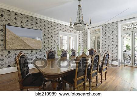 Stock Photo - Table and chairs in ornate dining room. Fotosearch