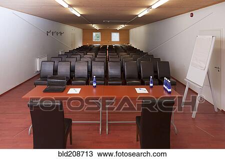 Tables and chairs arranged for a presentation, with a whiteboard View Large Photo Image Stock Image - Tables and chairs arranged for a presentation, with a whiteboard. Fotosearch