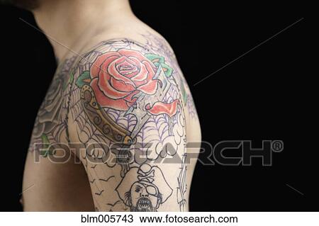 Tattooed shoulder of Hispanic man View Large Photo Image Stock Image - Tattooed shoulder of Hispanic man. Fotosearch