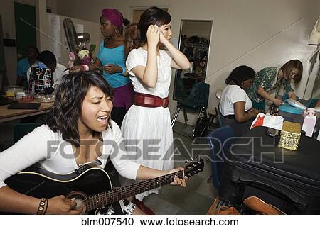 Teenage girls getting ready backstage View Large Photo Image Stock Image - Teenage girls getting ready backstage. Fotosearch