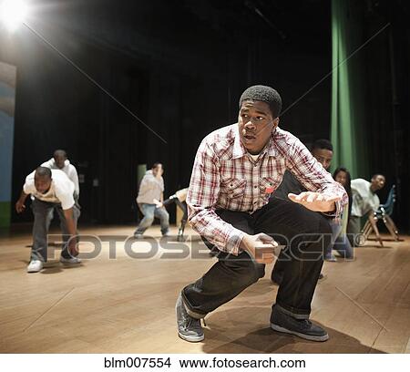 Teenagers rehearsing on stage View Large Photo Image Picture - Teenagers rehearsing on stage. Fotosearch