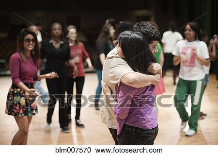 Stock Image - Teenagers rehearsing on stage. Fotosearch