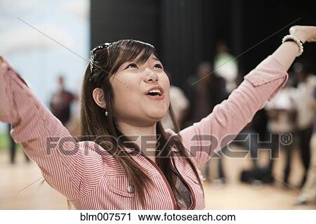 Stock Image - Teenagers rehearsing on stage. Fotosearch
