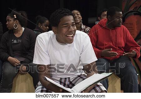 Stock Photo - Teenagers rehearsing on stage. Fotosearch