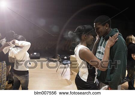 Stock Photograph - Teenagers rehearsing on stage. Fotosearch