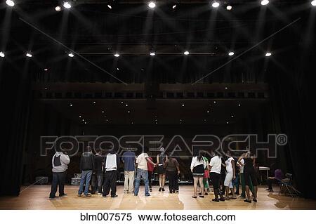 Stock Photography - Teenagers rehearsing on stage. Fotosearch