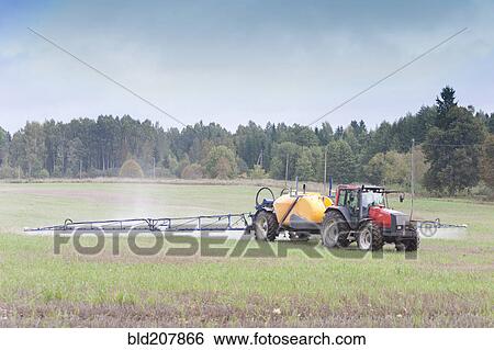 Stock Photograph - Tractor Spraying Herbicide. Fotosearch