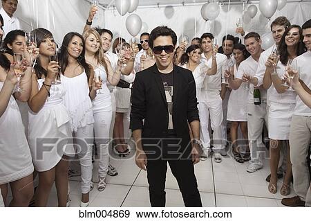 Trendy man at festive party View Large Photo Image Stock Photo - Trendy man at festive party. Fotosearch