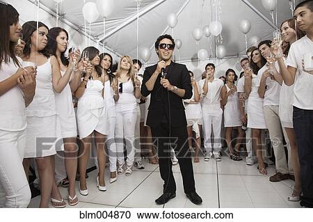 Trendy man singing at festive party View Large Photo Image Stock Image - Trendy man singing at festive party. Fotosearch