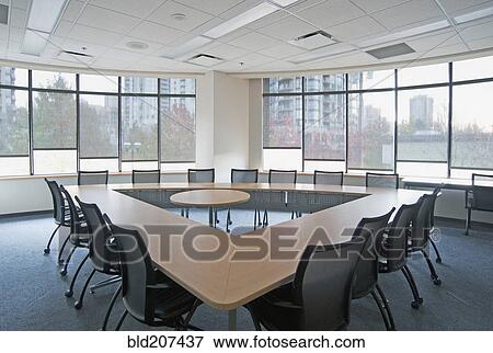 Triangle table in conference room View Large Photo Image Stock Photo - Triangle table in conference room. Fotosearch