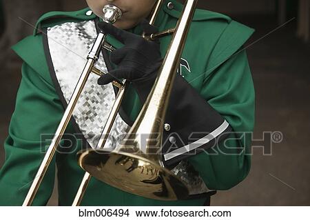 Picture - Trombone player in marching band. Fotosearch