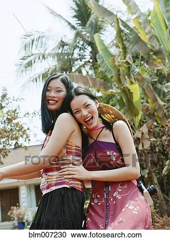 Two women on bicycle View Large Photo Image Stock Image - Two women on bicycle. Fotosearch