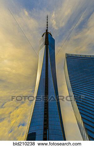Stock Photo - Urban skyscraper and cloudy sky, New York, New York, United States. Fotosearch