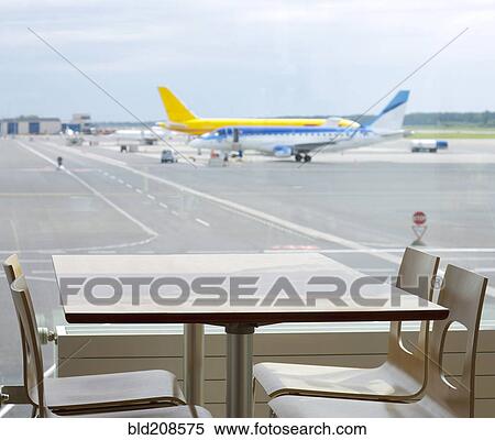 Stock Photography - View from a table by the window of the airport caf. Fotosearch