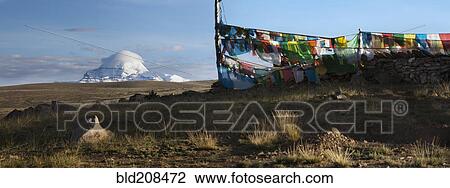 Stock Image - View of Mount Kailash from Chiu Gompa or Monastery with Prayer flags fluttering in the wind. Fotosearch